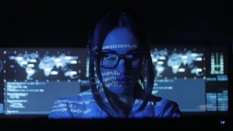 Woman Hacker programmer in glasses is working on computer in cyber security Stock Footage 86211044