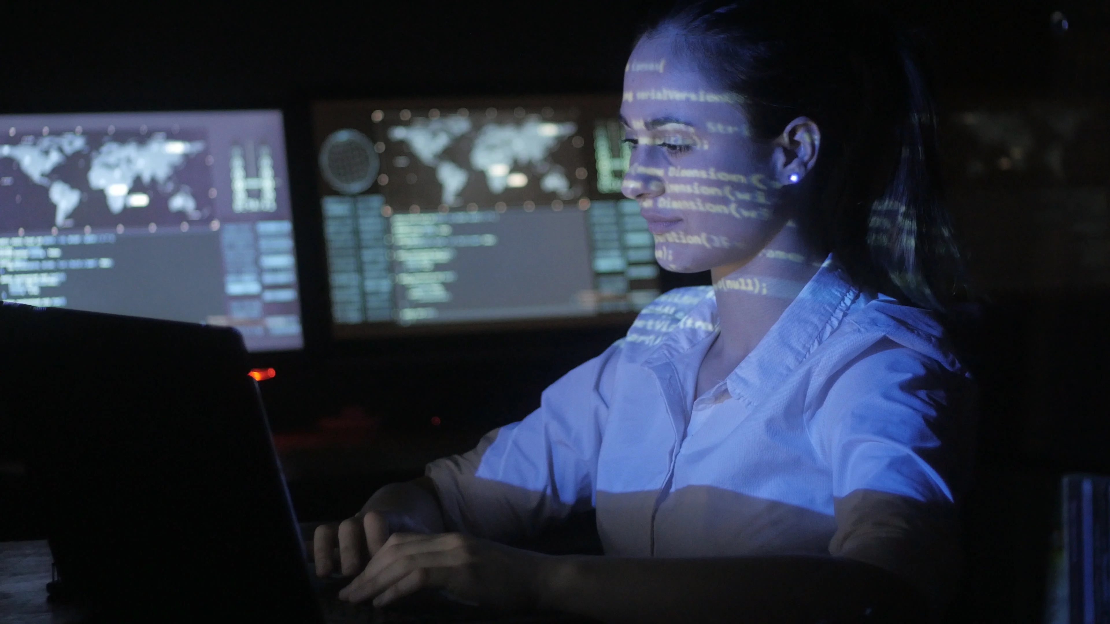 A female hacker in action using the co, Stock Video