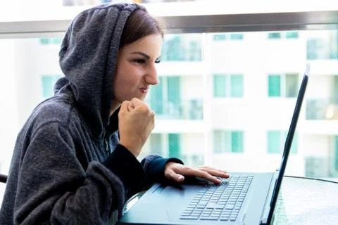 Woman Hacker programmer is working on computer in cyber security center filled Stock Photos
