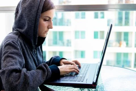 Woman Hacker programmer is working on computer in cyber security center filled 스톡 사진