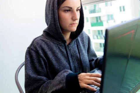 Woman Hacker programmer is working on computer in cyber security center filled Stock Photos