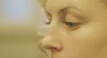 woman half-face with her blue eyes - macro HD Footage