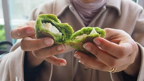 Woman hand braking a bread in closeup Stock Footage 336830690
