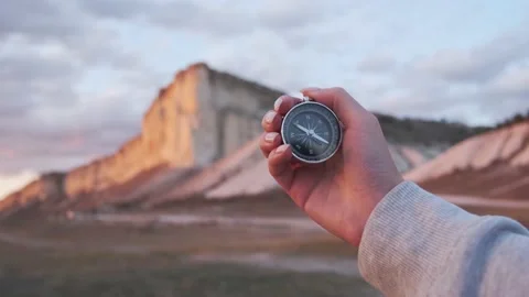 Woman hand with a compass in front of White Rock, Crimea. Stock Footage 145675371