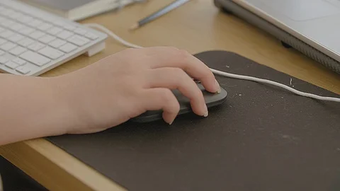 A woman hand on a computer mouse Stock Footage 93447111