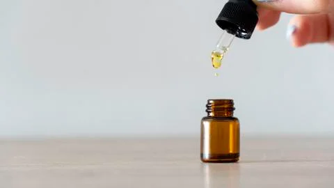 Woman Hand Dripping Essential Oil Stock Photos