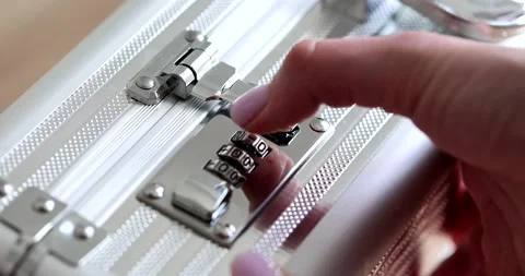 Woman hand entering digital code open metal suitcase with money closeup 4k movie Stock Footage 236992058