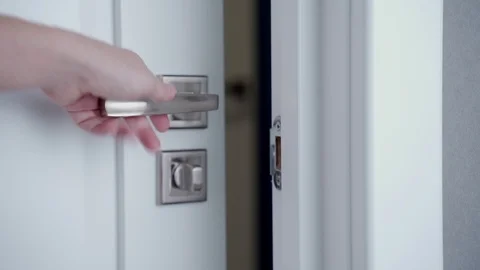 A woman hand locking the door Stock Footage 125187853