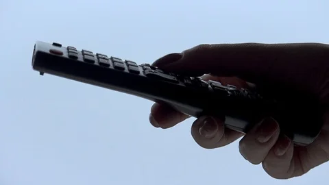 Woman hand operating a tv remote control Stock Footage 101818495