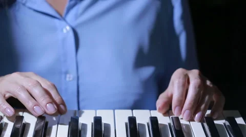 Woman hand playing a MIDI controller keyboard synthesizer close up. Stock Footage 67352959