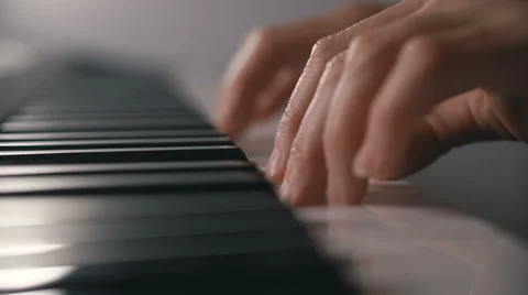 Woman hand playing a MIDI controller keyboard synthesizer close up Stock Footage 68998533