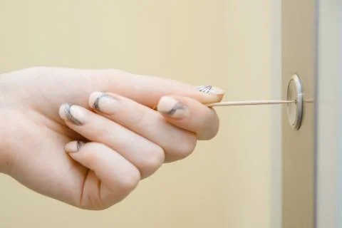 Woman hand presses elevator button with sweep. Concept coronavirus disinfection Foto stock