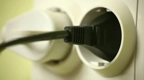 Woman Hand Pulls Plug out of the Wall socket Stock Footage 12725548
