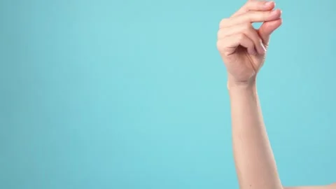 Woman Hand Snapping Fingers on Light Blue Background Vidéo 346113121