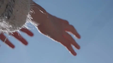 Woman hand stretched serenity facing the sky, the cold wind blows on his swea Stock Footage 171982980