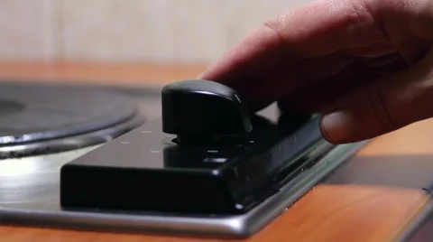 Woman Hand Turning On A Button Of An Electrical Stove, Kitchen Video stock 43535002