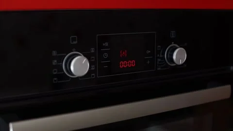 Woman hand turning switch control and turns off the electric oven after timer Stock Footage 155801732