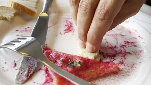 Woman Hand Using Bread to Pick Up the Savory Sauce with Beetroot Ravioli on a 스톡 동영상 271002076