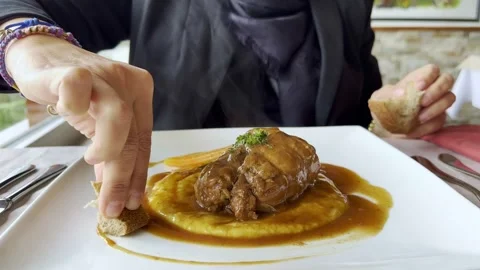 Woman Hand Using Bread to Pick Up the Savory Sauce on a White Plate With 스톡 동영상 274318174