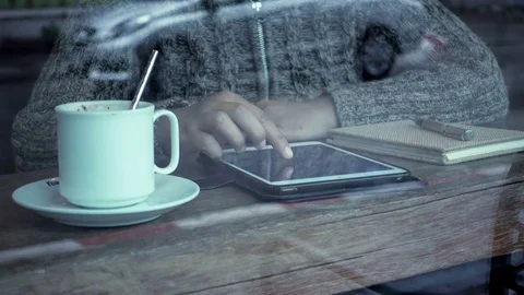 Woman hand using digital tablet to search data in the cafe Stock Footage 76271837