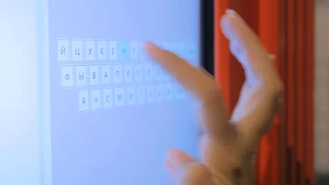 Woman hand using interactive virtual russian keyboard Stock Footage 87683937