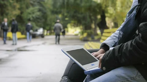 Woman hand using laptop on her lap Stock Footage 33625630