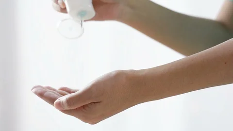 Woman hand using liquid hand sanitizer to washing hands to preventtion virus. Stock Footage 128380360