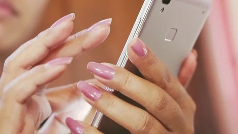 Woman hand using mobile phone, scrolling pictures phone, searching on internet Stock Footage 80532267