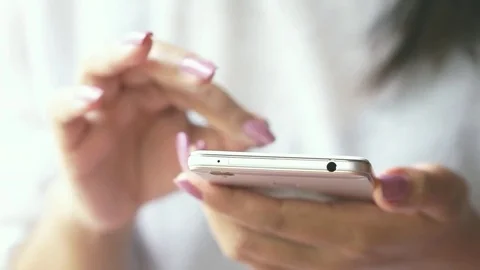 Woman hand using smart phone connecting to internet and social media Stock Footage