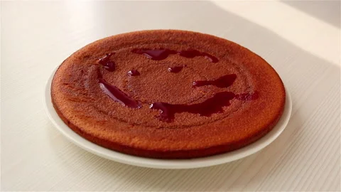 Woman hand using spoon pouring syrup on homemade sponge cake soaking 스톡 동영상 147635247