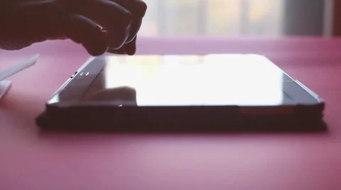 Woman hand using tablet computer pc near the window, natural light indoor Stock-Footage 57845969