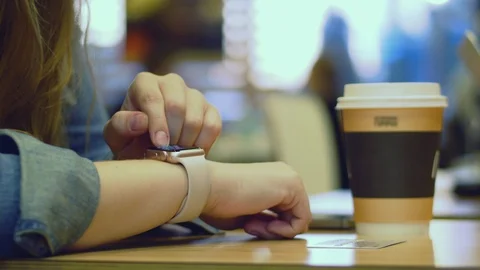 Woman hand using tablet computer pc commuters in background. 4K. Stock Footage 92679824