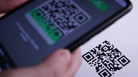 Woman hand view while Scanning a QR code With a Smartphone. 스톡 동영상 154350811