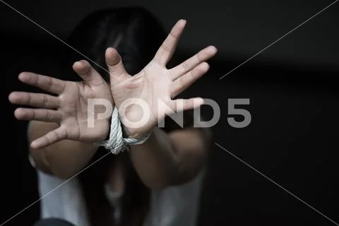 Woman hand were tied with a rope. Stop Violence, Terrified, Human Rights Day Stock Photos