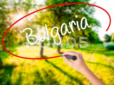 Woman Hand Writing Bulgaria with a marker over transparent board Stock Photos