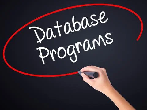 Woman Hand Writing Database Programs with a marker over transparent board . Foto stock