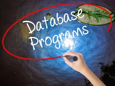 Woman Hand Writing Database Programs with marker over transparent board. Foto stock