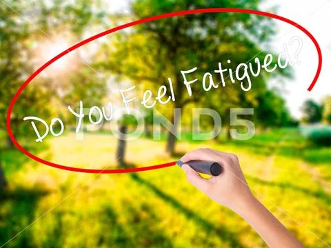 Woman Hand Writing Do You Feel Fatigued? with a marker over tran Stock Photos