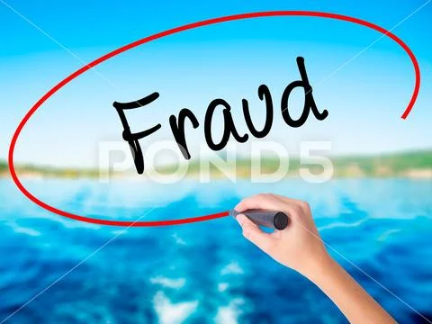 Woman Hand Writing Fraud with a marker over transparent board Stock Photos
