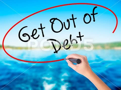 Woman Hand Writing Get Out of Debt with a marker over transparen Stock Photos