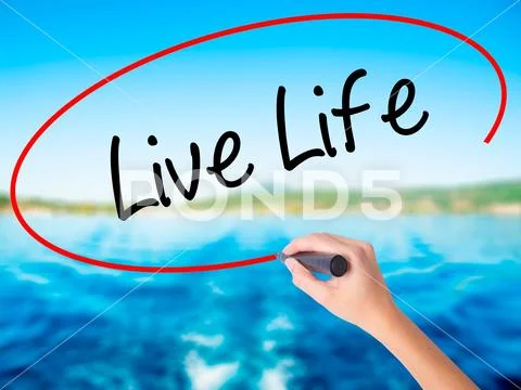 Woman Hand Writing Live Life with a marker over transparent boar Stock Photos