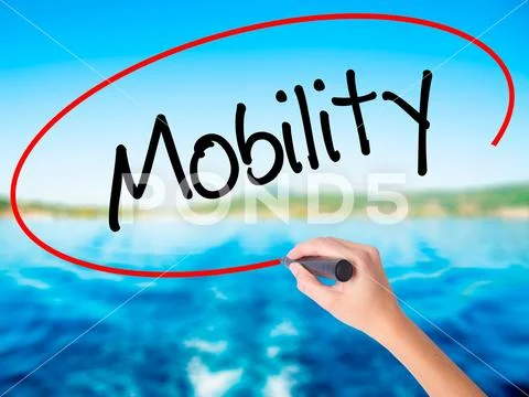 Woman Hand Writing Mobility with a marker over transparent board Stock Photos