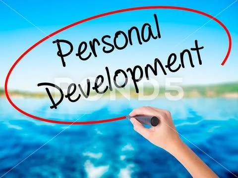 Woman Hand Writing Personal Development with a marker over tran Stock Photos