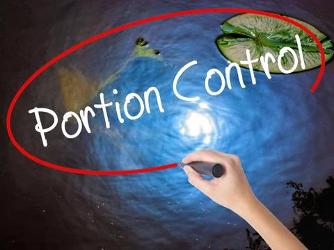 Woman Hand Writing Portion Control with marker over transparent board Stock Photos