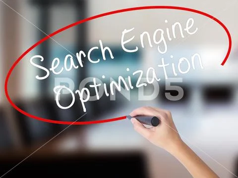 Woman Hand Writing Search Engine Optimization with a marker over Stock Photos