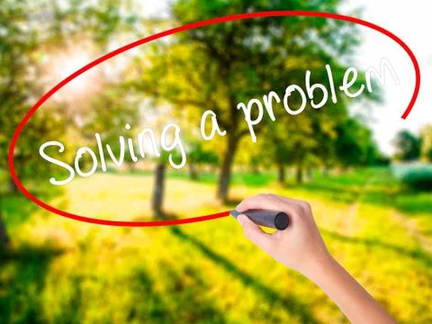 Woman Hand Writing Solving a problem with a marker over transpar Foto stock