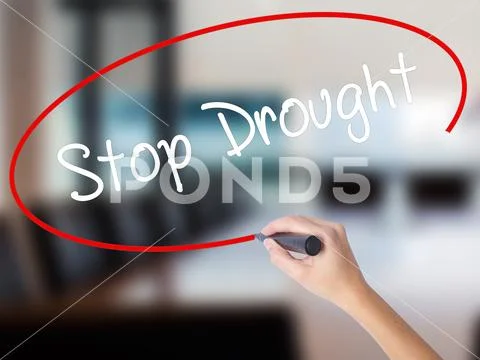 Woman Hand Writing Stop Drought with a marker over transparent Stock Photos