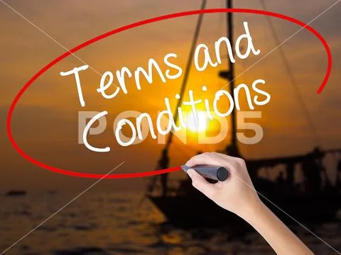 Woman Hand Writing Terms and Conditions with a marker over trans Stock Photos