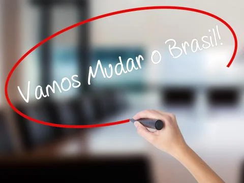 Woman Hand Writing Vamos Mudar o Brasil! (Let's Change Brazil in Portuguese)  Stock Photos