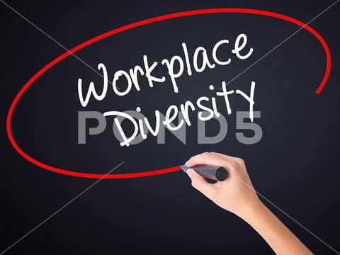 Woman Hand Writing Workplace Diversity with a marker over trans Stock Photos